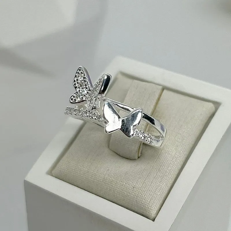 ANEL CRAVEJADO DUO BORBOLETAS AP2016